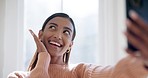 Smile, selfie and young woman at her home with positive, good and happy attitude for self love. Wink, happiness and Indian female person taking a picture with cosmetic makeup in modern apartment.