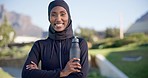 Face, fitness and Islamic woman with arms crossed, health and water bottle with a smile, workout and training. Portrait, Muslim person and happy athlete outdoor with liquid, happiness and confidence