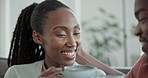 Laughing, talking and a black couple with coffee on the sofa for relax, conversation and love. Happy, house and an African man and woman with a tea, drink and speaking on the living room couch