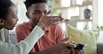 Ignore, video game and couple on sofa upset for gaming with upset, sad and lonely girlfriend in living room. Home, dating and African man and woman with conflict, fight and asking for attention