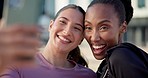 Happy woman, friends and city for selfie, memory or outdoor photography together in fitness. Interracial people smile for photograph, picture or social media in urban town after workout or exercise