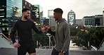 Fitness, running and friends fist bump, celebrate and happy for marathon training, cardio achievement or exercise. Workout partner, urban city and athlete team smile for challenge success in New York