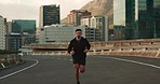 Fitness, running and and man in a city street for marathon, training or performance, energy or resilience. Workout, challenge and male runner in a road with speed, challenge or cardio sports exercise