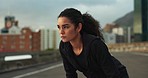 Breathing, road and fitness of woman with rest from training, exercise and workout on city street. Marathon, runner and wellness of a female athlete relax from running outdoor with sport and fatigue