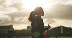 Running, headphones and woman with exercise, fitness and sun flare with training, energy and health. Runner, person and girl with headset, practice and workout with wellness, sports and challenge