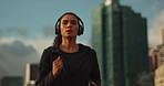 Running, headphones and woman with training, city and exercise with cardio energy and challenge. Runner, healthy person or athlete with headset, practice and workout with wellness, sports and fitness