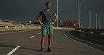 Sunrise, fitness and man in city street for running, training and resilience, performance and speed challenge. Highway, runner and male athlete in a road for marathon practice run, sports or cardio