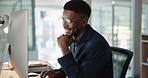 Thinking, businessman and reading on computer with a smile in office for email, feedback or communication. Working, online or black man with research, inspiration or ideas from Nigeria report or news