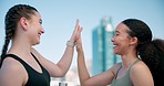 Happy, fitness or friends in city high five for goals, motivation or winning target in celebration together. Sports success, teamwork or excited women with progress after running workout or exercise 