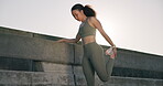 Woman, fitness and stretching legs outdoor in the city for cardio, running or exercise with sportswear. Athlete, person and runner with feet warm up and ready for morning workout or training for body