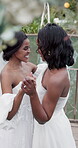 Happiness, wedding and lesbian women dancing outdoor together at ceremony for celebration, happiness and romance. Marriage, love and lgbtq people holding hands and moving with smile in elegant dress