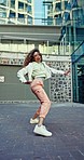 Dance, hip hop and woman in city with fashion, freedom and happiness with music in urban town. Energy, happy and portrait of person in trendy, streetwear clothes for art, talent and performance