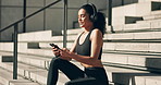 Fitness, woman and headphones with smartphone on stairs for communication, exercise music and relax mindset. Wellness, athlete and phone for listening to radio or audio for training, running and chat