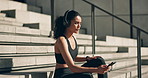Fitness, woman and headphones with phone on stairs for workout motivation, exercise music and relax mindset. Wellness, athlete and smartphone for listening to radio or audio for training and running