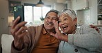 Senior couple, video call and wave on sofa, smile and hug with love, phone and relax in retirement in home. Elderly woman, old man and webinar with chat, together and talking on living room couch