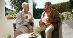 Mature couple, happiness and coffee in garden on retirement, bonding and conversation with cookies. Mexican seniors, communication and sunshine with countryside for romance and enjoyment in old age