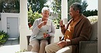 Senior couple, drinking coffee and talking in outdoors, retirement and love for bonding, marriage and trust. Laughing old mexican people, support and relax on porch with food and morning conversation