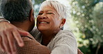 Senior, couple and hug with happiness outdoor in nature for love, connection and commitment or care. Old people, man and woman with embrace and smile for relationship, bonding and romance or support