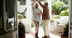 Love, dance and retirement with a senior couple in their home together for romance or to relax. Smile, music and marriage with elderly people on the veranda of their apartment for old age bonding