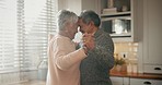 Retirement, home and senior couple in dance and love in home, kitchen or living room with care and support together. Happy, elderly people and dancing with freedom, peace and happiness in marriage