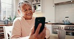 Headphones, cellphone and senior woman in the kitchen listening to music, album or playlist. Happy, dance and elderly female person streaming song and reading blog on social media or internet at home