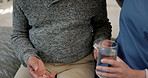 Old man, person and drink pills with nurse support for healthcare, wellness and care in bedroom of nursing home. Senior, professional and woman help patient with medicine for healing and lifestyle