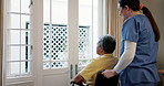 Senior, man in wheelchair and nurse with communication for healthcare support with caregiver in nursing home. Old person, medical and professional for elderly care in bedroom of house or clinic