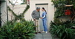 Cane, walking and caregiver help senior man at a retirement home as support and care in a backyard. Movement, recovery and nurse with elderly person for rehabilitation at outdoor house for health
