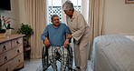 Wheelchair, helping and senior couple in bedroom together in retirement with person with disability. Support, home and marriage of elderly people with empathy, kindness and love with care in a house