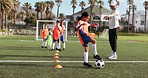 Soccer ball, girl cardio and training for game and sport drill for workout and exercise on a school field. Students, coaching and children with teamwork, player and team with youth athlete group