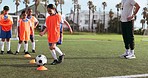 Soccer ball, girl and training for game and sport drill for workout and exercise on school field. Students, coaching and children with teamwork, player and team together with youth and athlete group