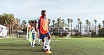 Soccer, kid kick and training  cardio for game and sport drill for workout and exercise on a school field. Students, coaching and children with teamwork, player and team with youth and athlete group