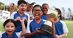 Football celebration, sports team trophy and children excited, happy or celebrate winning, competition victory or success. Soccer player prize, teamwork achievement and kids smile for game victory