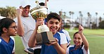 Soccer player celebration, sports team trophy and children excited, happy or celebrate winning, competition victory or success. Football gold prize, winner achievement and kids smile for game victory