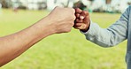 Fist bump, greeting and friends outdoor for trust, cooperation and solidarity. Hands together, closeup and meeting of people in collaboration, support teamwork and partnership connection in nature