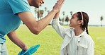 High five, recycling and a man with a girl child outdoor on a field together for eco friendly support. Motivation, volunteer and a father with his daughter for community or climate change awareness