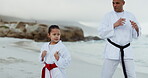 Beach, karate teacher or kid learning martial arts, fighting or self defense for wellness or fitness. Man, master or coach teaching a young girl or student in workout, exercise or training in nature