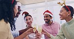 Christmas, friends and champagne glasses with cheers in home, and celebration for holiday event. Diversity, community and vacation with party in dining room, toast and alcohol for dinner with drinks