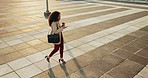 Top view, city and woman with a smartphone, walking and typing with professional, connection and social media. Person, employee or worker with a coffee, outdoor and cellphone with digital app or post