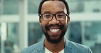 Face, smile and black man with business, glasses and office with professional, corporate and happiness. Portrait, African person and happy employee in a workplace, career and employee with eyewear 