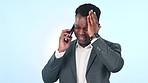 Phone call, stress and business black man in studio frustrated in conversation, talking and discussion. Communication, smartphone and upset person for anxiety, bad news and worried on blue background