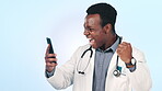 Doctor, man and phone success, celebration and wow for healthcare news, results or announcement on blue, studio background. Excited african person or winner for medical achievement or goals on mobile