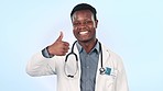 Happy black man, doctor and thumbs up in healthcare review or feedback against a studio background. Portrait of African male person or medical surgeon with like emoji, OK or yes and no sign in advice