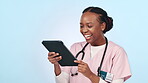 Doctor, woman and tablet for medical planning, clinic results and schedule or telehealth services in studio. Professional african nurse laughing on digital tech or healthcare meme on blue background