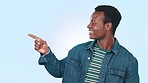 Happy, pointing and black man in studio with mockup space for marketing, promotion or advertising. Happiness, smile and portrait of young African model with ok gesture isolated by white background.