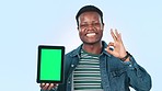 Black man, tablet green screen and okay hands in success, student advertising or presentation in studio. Face of African person on digital mockup, college or university application on blue background