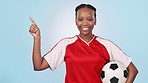 Soccer, black woman point and sports thumbs up for fitness opinion, agreement or studio promotion, advertising or logo design. Workout portrait, exercise vote and football player on blue background