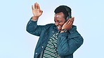 Dance, headphones and excited black man on blue background for streaming song, radio and audio. Happy, freedom and person listening to track, music and move with energy, fun and happiness in studio