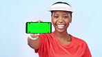 green screen, phone and woman in studio for sports, fitness and wellness on blue background. Mockup space, advertising and person with smartphone for mobile app, social media and website promotion