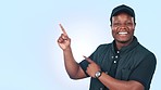 Smile, pointing and face of black man in a studio for marketing, promotion or advertising. Happy, choice and young African male model with decision, guidelines or steps gesture by white background.